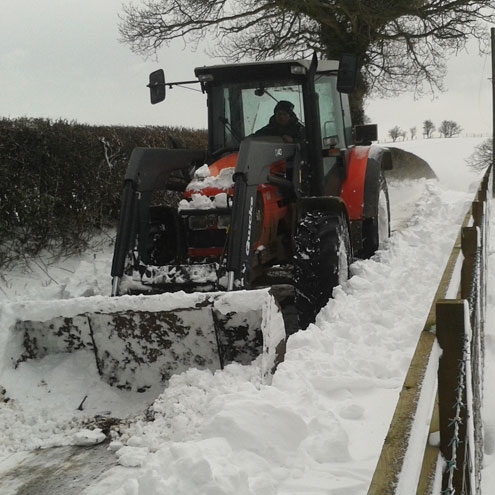 Clearing snow with tractor
